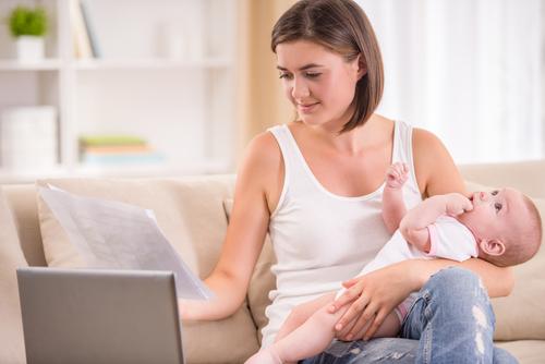  what is slapped cheek syndrome? a mum holding her baby, searching online to learn about the slapped cheek rash and the other symptoms of slapped cheek syndrome