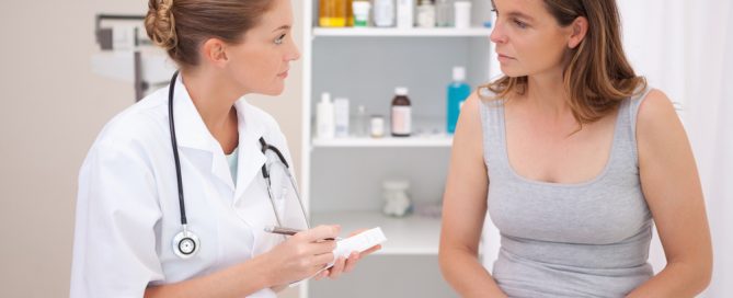 a woman speaking to a nurse about vaginal discharge and vaginal infection