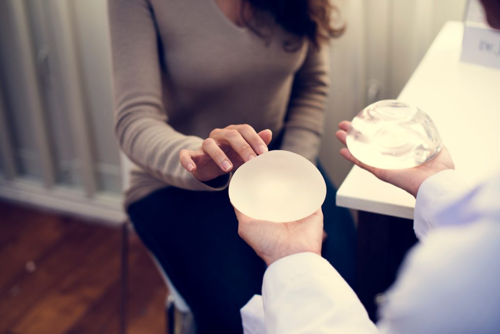 Woman,Planning,To,Have,A,Breast,Implant The risks of any type of surgery include infection, trauma to the face or body and surrounding tissue and excessive bleeding