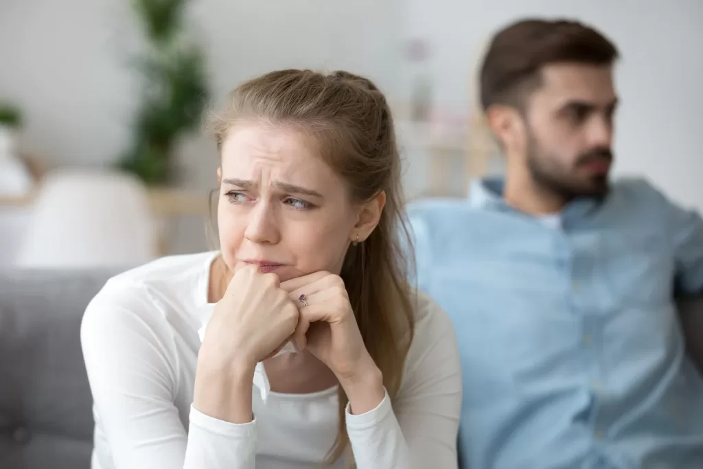 Upset female look in distance thinking of relationships problems or breakup