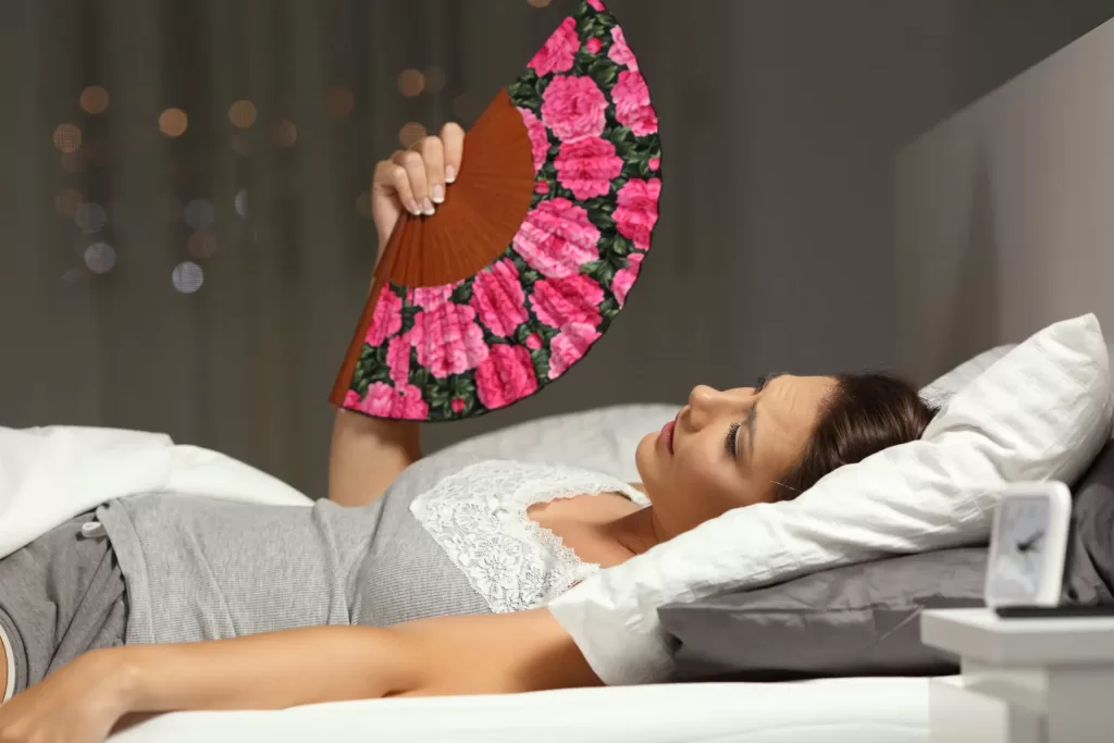 underlying-medical-conditions-can-be-linked-to-night-sweats-scaled Woman lying in bed drenched in perspiration experiencing night sweats