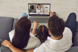 family on a telehealth call at home to get a carer's certificate