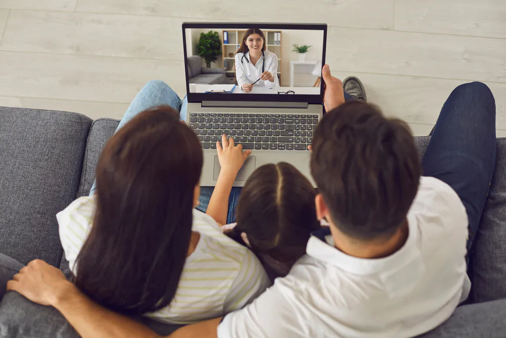 family on a telehealth call at home getting a carer's certificate